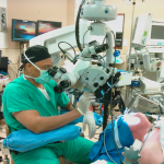 Figure 1 A surgeon using Photomedix  electro-mechanical manipulator